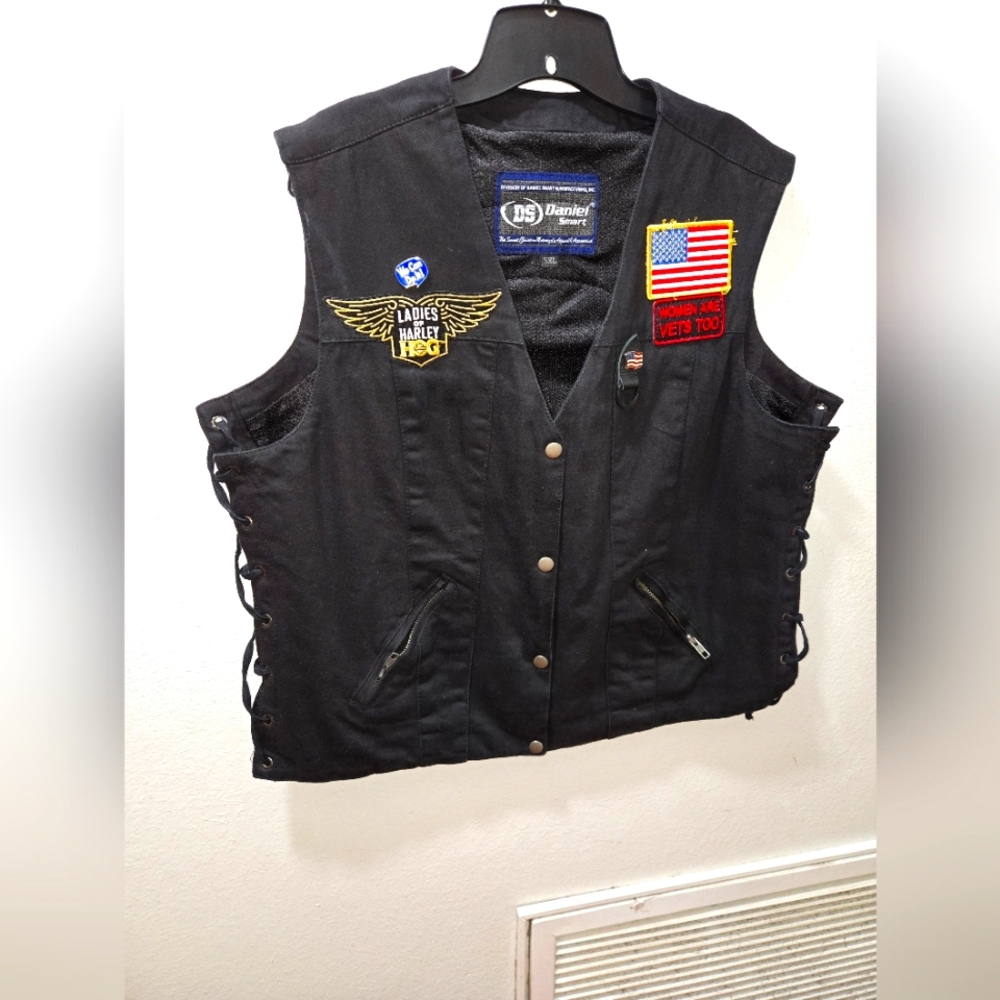 Women's riding vest, heavy duty with laces on sides.